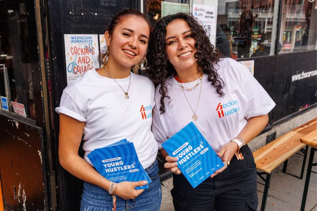 Two Hockley Hustle volunteers with Young Hustlers leaflets